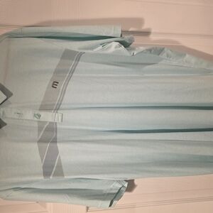 Travis Mathew XXL polo. Color is a light green.